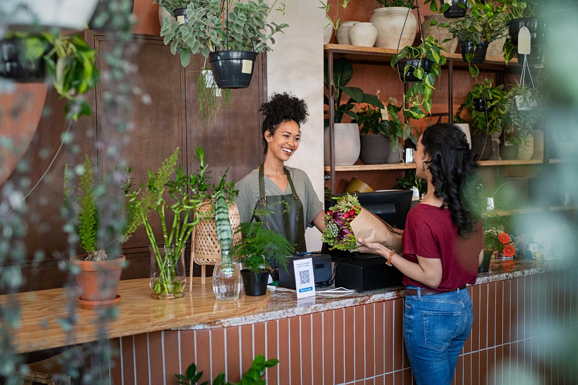 Flower Shop Worker Checking Out Guest